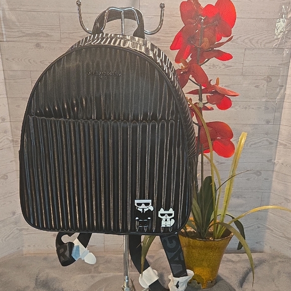 Karl Lagerfeld Handbags - Stunning Karl Lagerfeld Black Backpack with Character Accents NWT